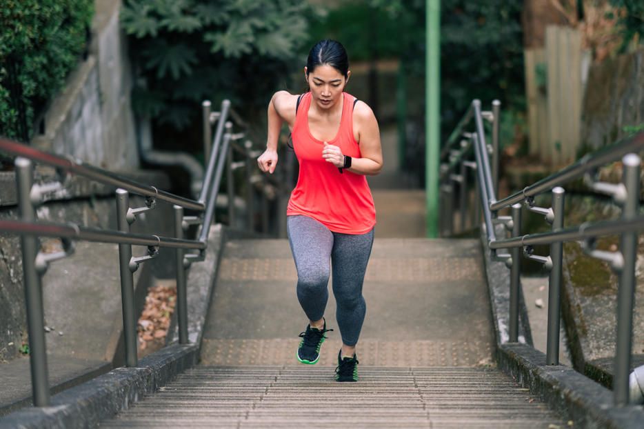 A woman running up stairs